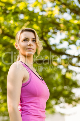 Fit blonde standing in the park