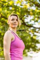 Fit blonde standing in the park