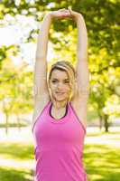 Fit blonde stretching in the park