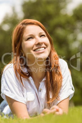 Pretty redhead happy and lying
