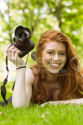 Beautiful female photographer at park