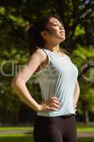 Side view of healthy woman standing in park