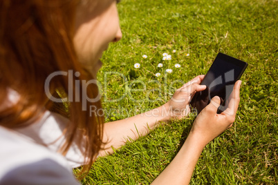 Pretty redhead text messaging on her phone