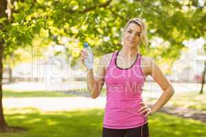 Fit blonde holding her water bottle