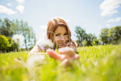 Pretty redhead happy and lying