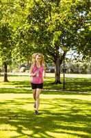 Fit blonde jogging in the park