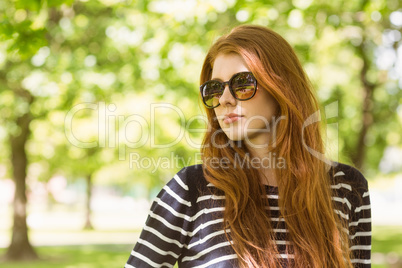 Beautiful woman looking away in park