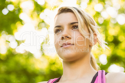 Fit blonde standing in the park