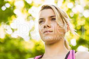 Fit blonde standing in the park