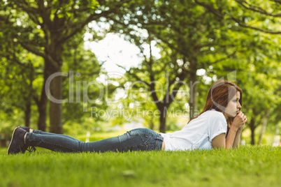 Pretty redhead thinking and lying