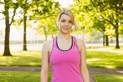 Fit blonde smiling at camera