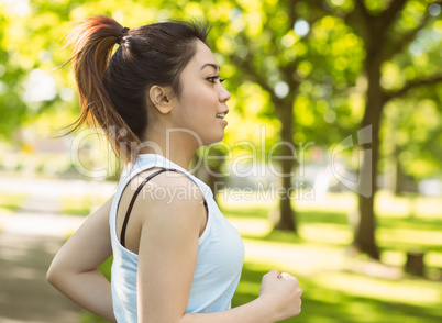 Healthy woman jogging in park