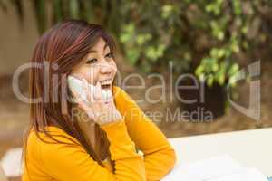 Woman using mobile phone in park