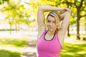Fit blonde stretching in the park
