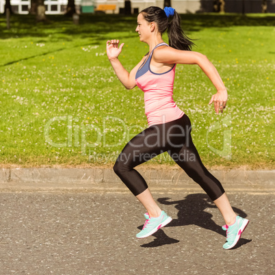 Fit brunette going faster on path