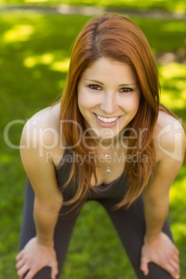 Portrait of a pretty cheerful redhead