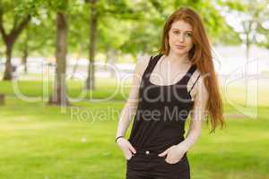 Beautiful young woman standing in park