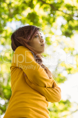 Beautiful woman looking away in park