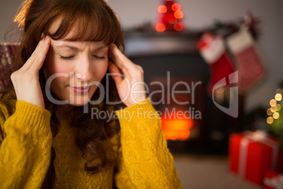 Redhead getting a headache on christmas day