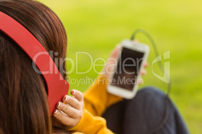 Close up of woman enjoying music in park