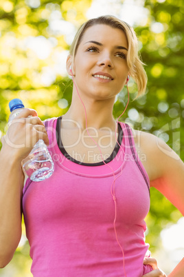 Fit blonde holding her water bottle