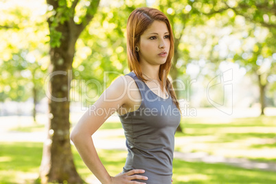 Pretty redhead resting in park