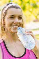 Fit blonde drinking from her water bottle