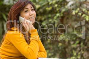 Woman using mobile phone in park