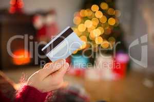 Woman holding credit card at christmas