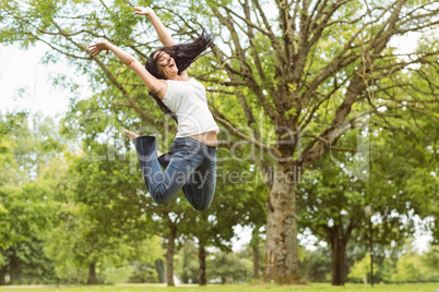 Excited and happy brunette jumping