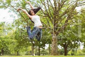 Excited and happy brunette jumping