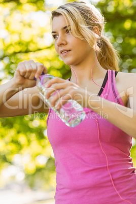 Fit blonde holding her water bottle