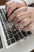 Male Hands Typing on Laptop Computer