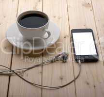 headphones and a cup of coffee