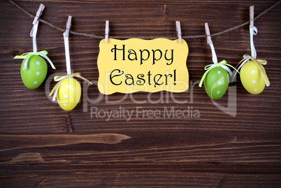 Yellow Label With Four Easter Eggs And Happy Easter