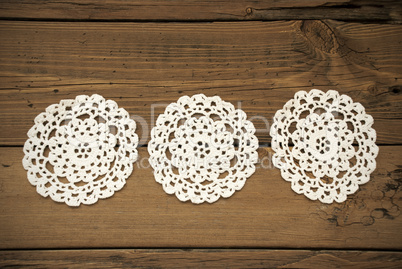 Three White Round Place Mat In A Row