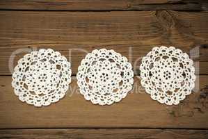 Three White Round Place Mat In A Row