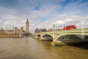 Red Double Decker Bus crossing Westminster Bridge. Icon of Londo