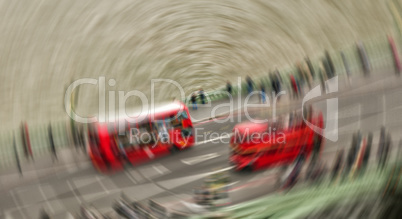 Blurred picture of fast moving iconic red Double Decker buses on