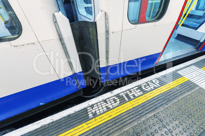 Famous Mind The Gap sign in London underground station