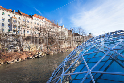 Graz city seen from Island on Mur river connected by a modern st
