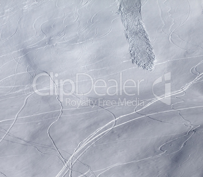 Off-piste slope with traces of skis, snowboarding and avalanche