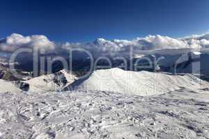 View on off-piste slope and snowy mountains