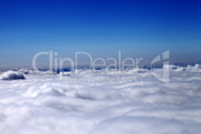 Mountains under clouds in sun day