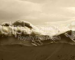 Sepia mountains in haze at sunny evening