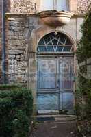 Old door in Puycelsi