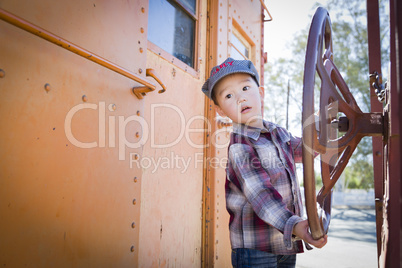 Cute Young Mixed Race Boy Having Fun on Railroad Car