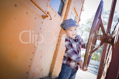 Cute Young Mixed Race Boy Having Fun on Railroad Car