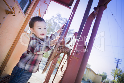 Cute Young Mixed Race Boy Having Fun on Railroad Car