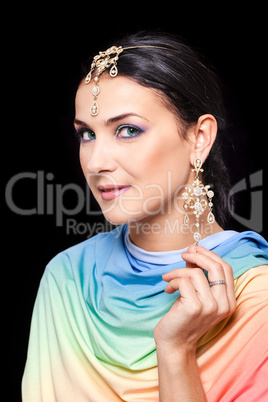 Portrait of a beautiful young woman in a bright colored fabric
